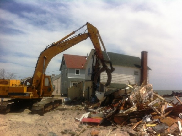 Not just another day at the beach -- the excavator at work on Hawks Nest.