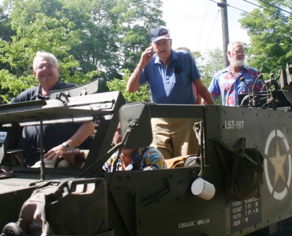 John Stratton (left) and Jim Noyes (center) rode in military style ...