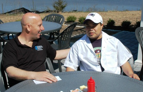 Sichanh catches up with Ron Swaney of Commercial Construction LLC for a relaxing moment after breakfast was over.