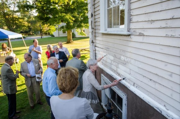 Making the momentous brushstrokes on the Sill House.