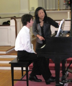 Mihae Lee works with a student at a Masterclass.