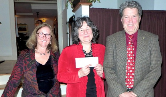 Pictured presenting the check are (from left to right) Chris Kitchings, owner of The Bowerbird, Marianne Szreders, President of L-OL Lions club and Phil Parcak, Vice-President of the L-OL Lions Club.