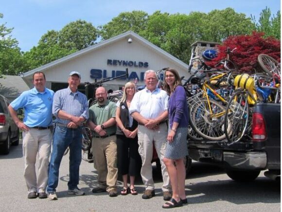 Many hands make light work during the bike pick-up at Reynolds Subaru in Lyme.