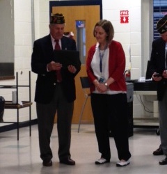 Roger Haynes presents Mary Bradford with a VFW award for Teacher of the Year.