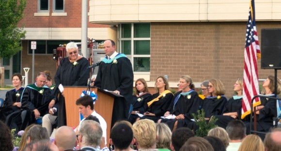 Region 18 Board of Education Chairman James Witkins (left) and Superintendent of Schools ian Neviaser stand at the podium in front of the speakers and board of education members.