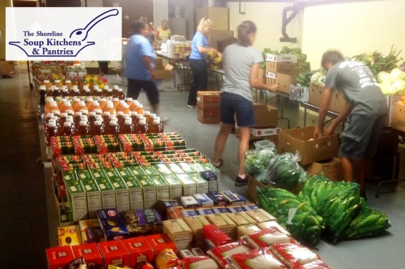 Volunteers set up for food distribution at the SSKP Old Saybrook pantry hosted by First Church of Christ in Saybrook, Congregational.