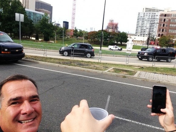 With an excited Kevin Hogan watching, Pope Francis drives by in his famous Fiat