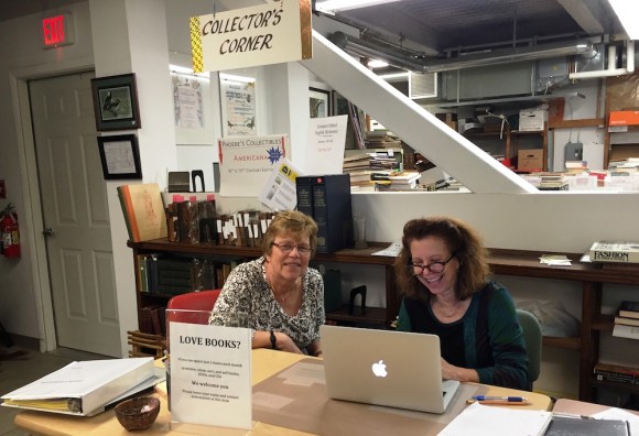 BookCellar Co-Managers Ann de Selding (right) and Claudia Condon check entries in the BookCellar's master catalog.
