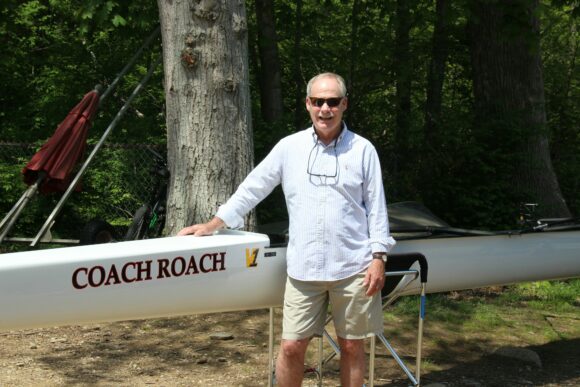 Rob Roach stands beside the just christened 'Coach Roach.'