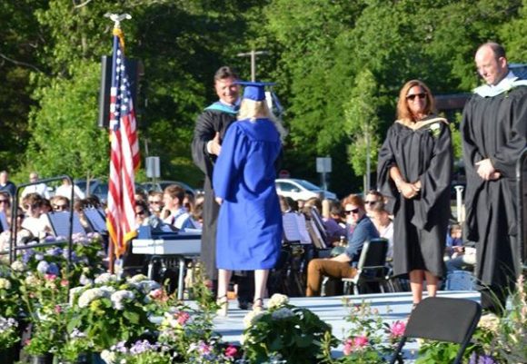Amber Bowker receives her diploma from Principal James Wygonik.