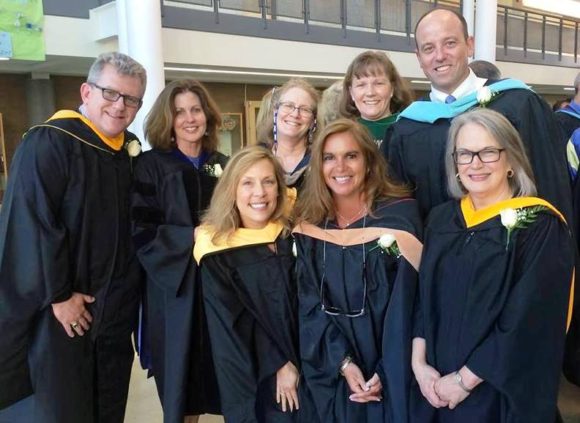 Members of the Region 18 Board of Education gather for a photo with Superintendent of Schools Ian Neviaser (back row, right).