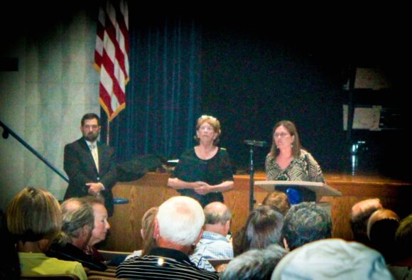 From left to right standing, Rob Pinckney of the BSC Group, meeting moderator Attorney Marylin C. Clarke and Old Lyme First Selectwoman Bonnie Reemsnyder listen attentively to a question from the floor.