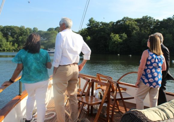 Eyes on the Cove -- guests on the 'Victoria' gaze at the view across the calm waters of Hamburg Cove.