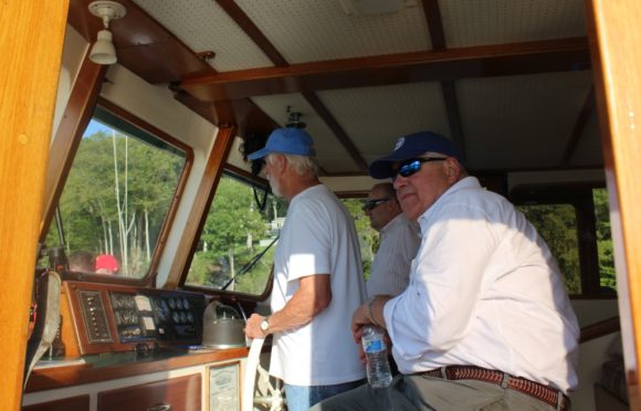 John Johnson, CPA board member (right) checks in with the captain of the 'Victoria.'