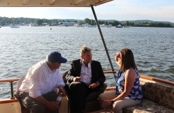 John Johnson (left) and Bonnie Reemsnyder (right), both CPA board members, chat with the CPA Chairman Scott bates.