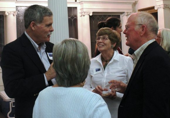 Former OL-PGN Board President Jack Collins (left) engages with library supporters.