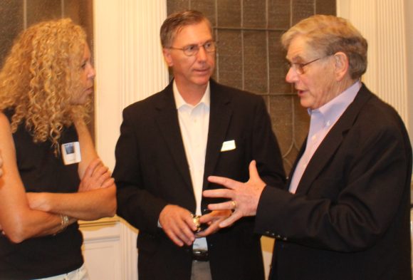 From left to right, leslie massa, Chairman of the Friends of the library, Alan Poirier, Library Board of Trustees President and David Winer, past Board President share memories of Mary's tenure.