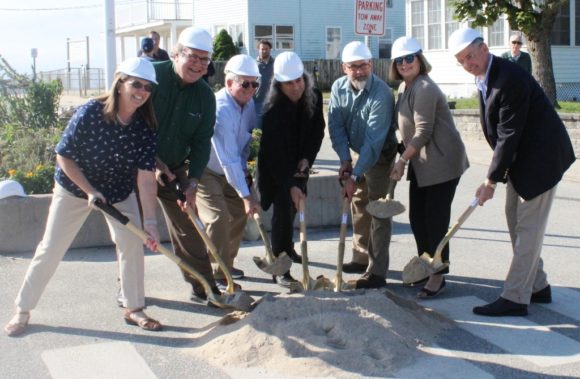 From left to right, Sound View Improvement Committee members Bonnie Reemsnyder, Frank Pappalardo, Jim Lampos, and MaryJo Nosal dig a ceremonial shovel in the sand at the groundbreaking on Hartford Ave. held Oct. 3.