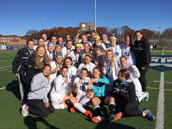 The team with their trophy.