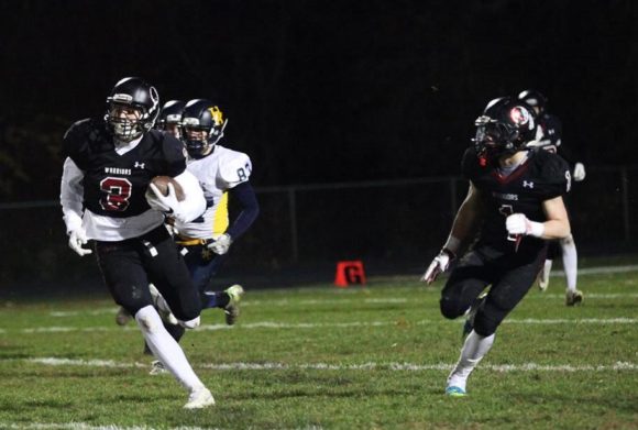 Garrett Burdick (#3) in action in last week's blow-out 31-0 victory over Haddam-Killingworth.