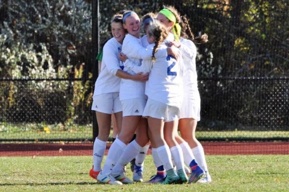 The Wildcats celebrate after defeating Coventry 2-0 in Saturday's game.