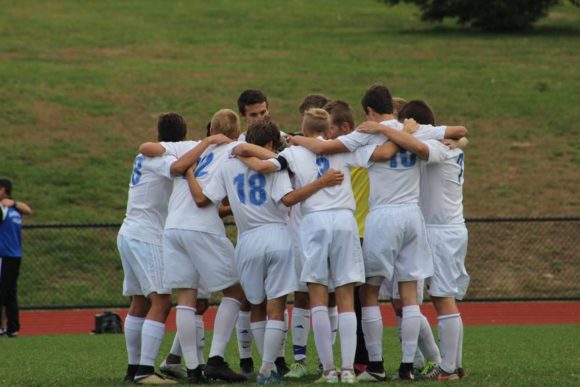 The traditional Wildcat huddle takes place before every game.