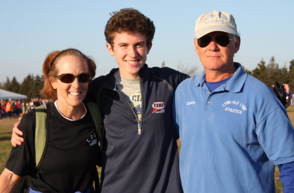 Nick stands with LOLHS Cross-country coaches Barbara O’Leary and Bill Raider in this 2011 photo.