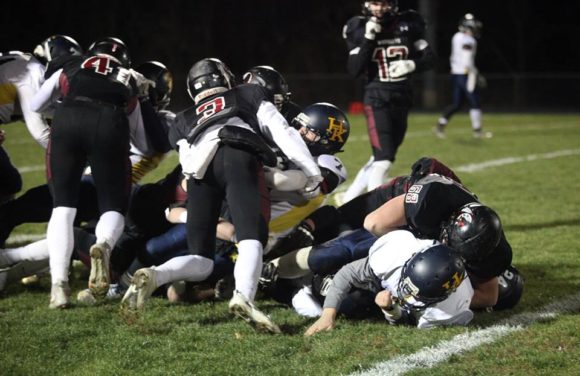 Warrior football action from the team's victory over H-K. File photo by Laura Matesky.